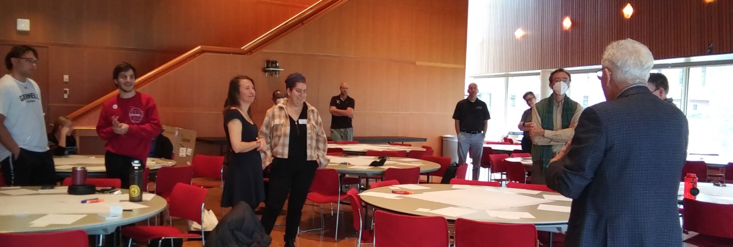 participants stand during a workshop activity.